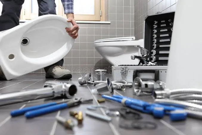 Close-up of hands repairing a bathroom sink fixture