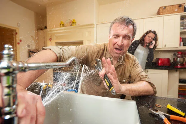 Quick Plumbing technician working under a sink
