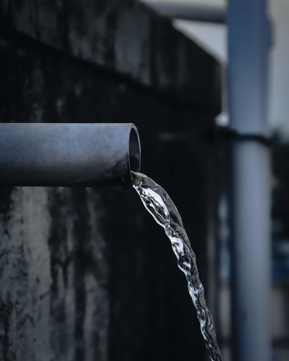 Water flowing from a pipe during a plumbing emergency